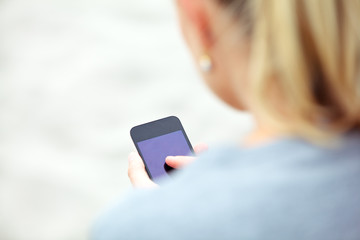 Woman messaging on a mobile phone