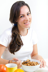 Young woman taking a breakfast cereal at home