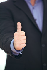 Businessman giving a thumbs up