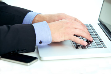 Young businessman using a laptop