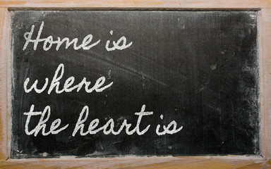 expression -  Home is where the heart is - written on a school b
