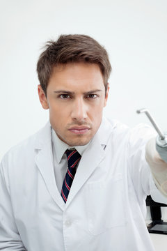 Dentist Holding Water Spraying Tool