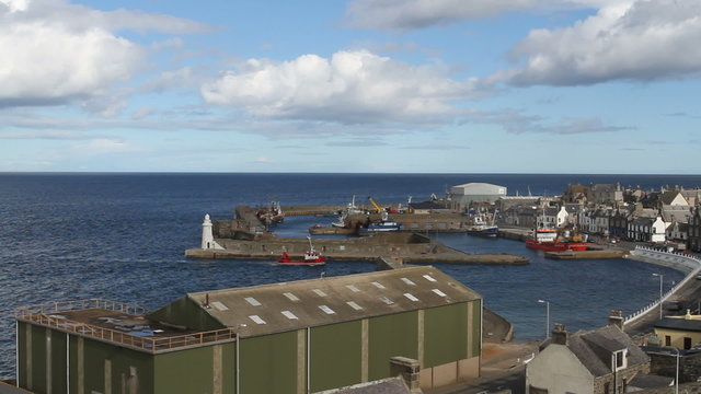 Boat arriving in Macduff harbour Scotland
