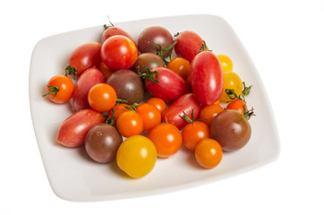 Fresh mixed tomatoes on plate