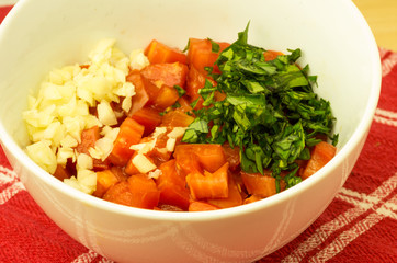 White bowl with chopped ingredients