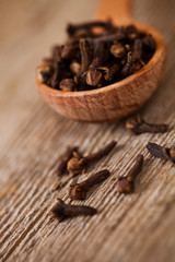 cloves in wooden spoon