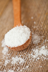 cooking salt in wooden spoon