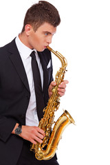 Obraz premium A young musician with a saxophone