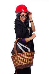 Portrait of beautiful girl posing on white background in red hel