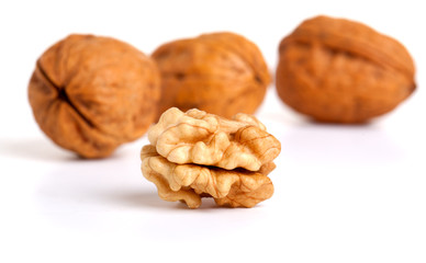 walnut and a cracked walnut isolated on the white background