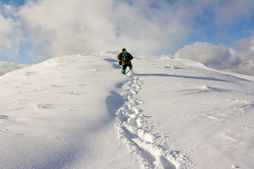 Hike in a winter mountain