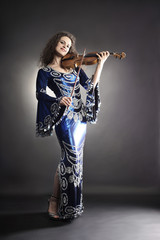 Beautiful woman musician with violin