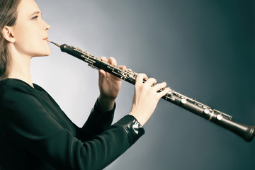 Classical musician oboe playing - obrazy, fototapety, plakaty