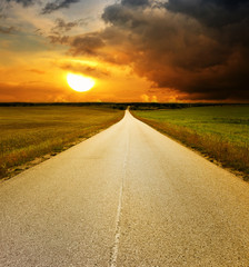 Fototapeta na wymiar Empty road and sunset