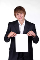 Portrait of happy smiling man holding banner - isolated over a w