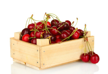 cherry in a wooden box isolated on white