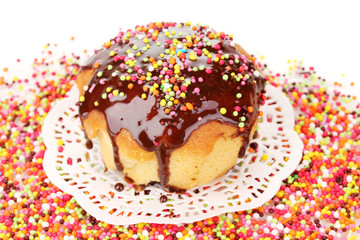 Appetizing chocolate cupcake close-up isolated on white