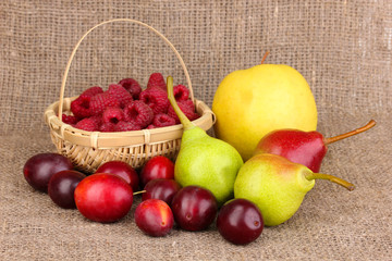 ripe sweet fruits and berries on sackcloth