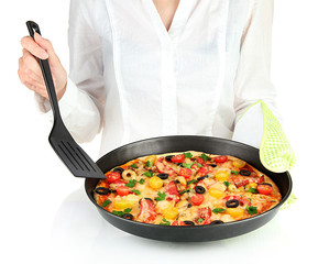 Chef holding a frying pan with baked pizza