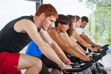 Group of People Cycling at Gym