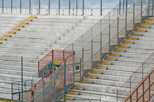 empty concrete bleachers of the stadium before a football game