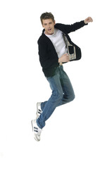 Cheerful young man jumping - isolated