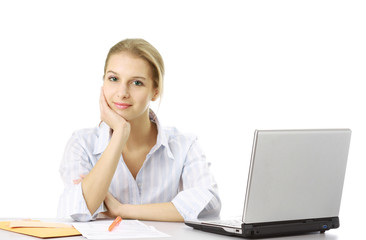 A young woman sitting in front of a laptop