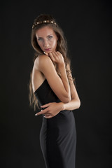 Fototapeta na wymiar A young woman in a black dress