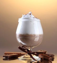 glass of coffee cocktail on brown background