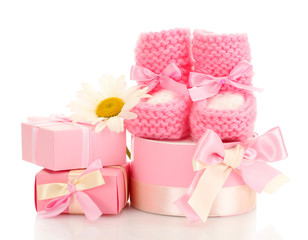 pink baby boots, gifts and flower isolated on white