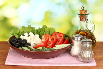tasty greek salad on bright green background