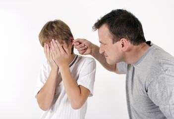 Strict father punishes his son. Isolated on white background