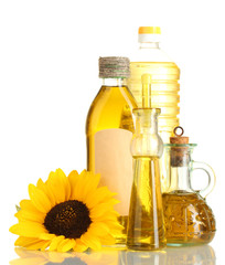 oil in jars and sunflower, isolated on white