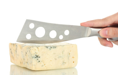 Woman's hand cut blue cheese on white background close-up