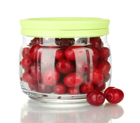 fresh cornel berries in glass jar isolated on white