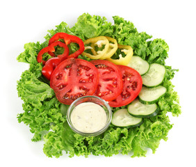 Chopped vegetables and sauce on plate isolated on white