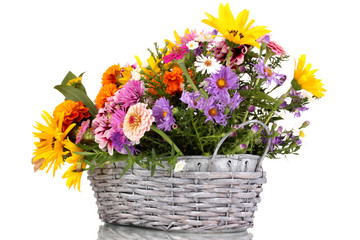 beautiful bouquet of bright flowers in basket isolated on white