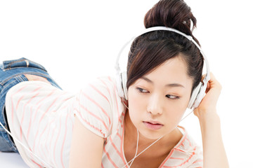 Naklejka premium Beautiful young woman listening to the music