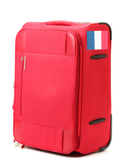 red suitcase with sticker with flag of France isolated on white
