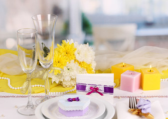 Serving fabulous wedding table in purple and yellow color of