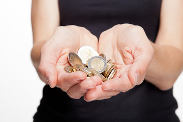 Closeup of woman's hands showing coins