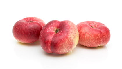 chinese flat peaches on white background