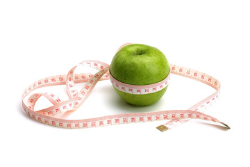 An apple with a measuring tape