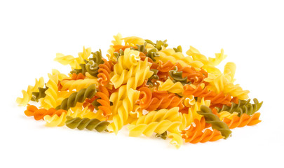 Uncooked pasta fusilli in different colours, white background