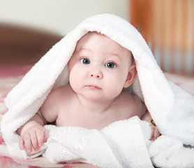 Little baby under white towel