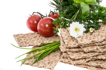 Crispbread with fresh Herbs on white