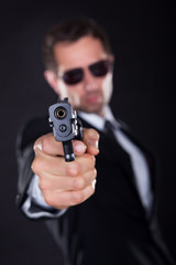 Portrait Of Young Man With Gun