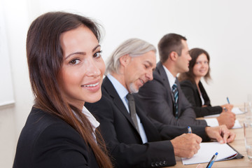 Business Woman In Meeting With Colleagues