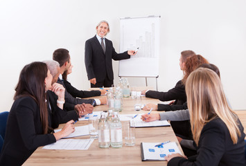 Portrait Of A Senior Manager Giving Presentation