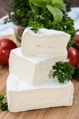 Camembert pieces on cutting board